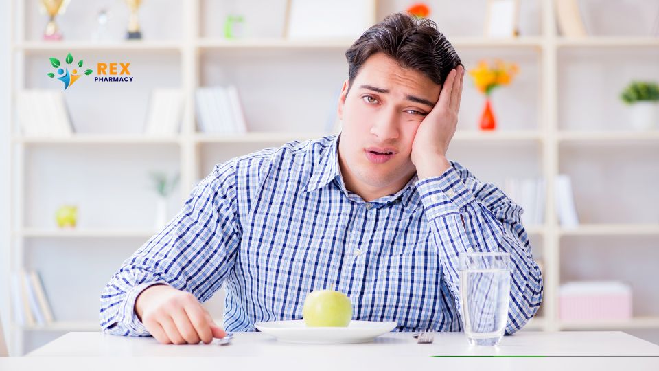 Overweight man eating an apple