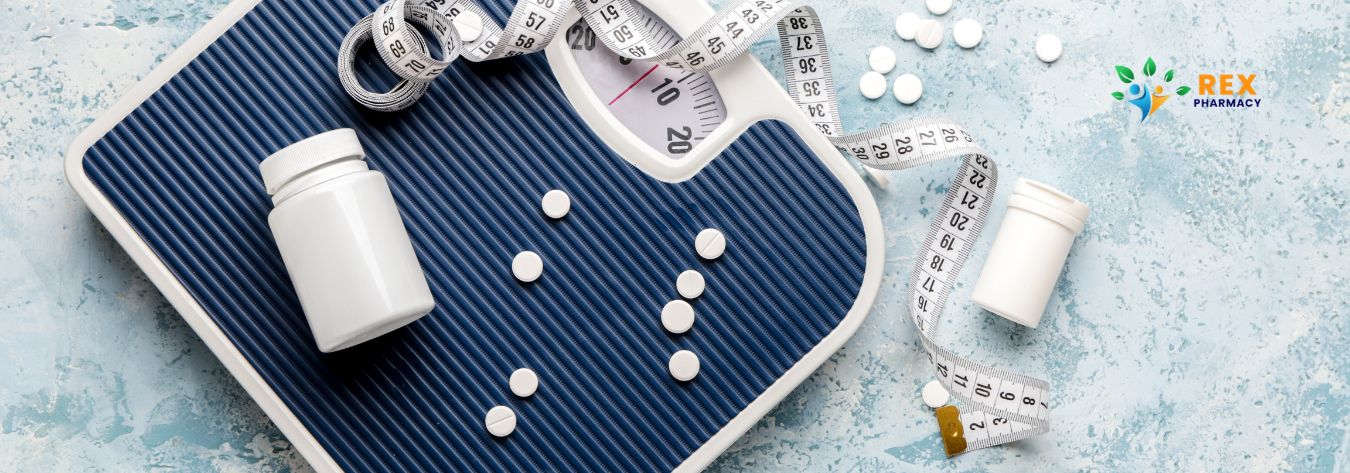 Weight loss tablets on a scale